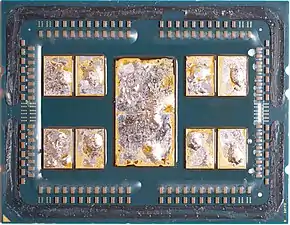 A delidded AMD 7702 featuring 8 CCDs and 1 I/O die, with remains of the solder thermal interface material (TIM) on the chiplets.