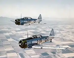 Two AT-6 Texans in flight near Luke Field in 1943.