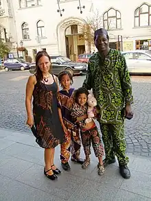 A picture of a Nigerian family wearing Ankara textile material.