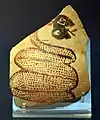 Shard of pottery decorated with a snake sticking out its tongue. Tell Arpachiyah, Iraq. Halaf period (6000-5000 B.C.). British Museum.