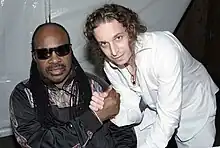 Kobi Arad (right) with Stevie Wonder (left)