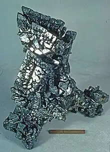 Acanthite - Locality: Chispas Mine, Arizpe, Sonora, Mexico. Scale is one inch with a ruled line at one cm.