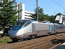 Silver and blue electric locomotive with a single cab