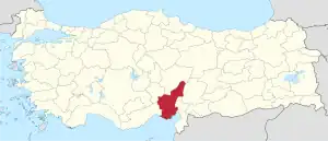 Adana highlighted in red on a beige political map of Turkeym