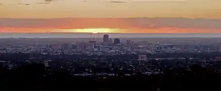 View of the eastern suburbs, the Adelaide city centre and the Gulf St Vincent at sunset from the summit.