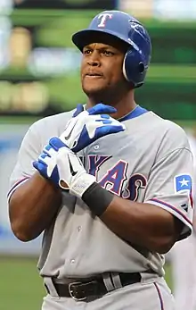 Adrian Beltre adjusts his batting gloves.