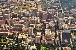 Aerial view of the Texas Medical Center's main campus looking south from Hermann Park. Brays Bayou is visible at the top of the image.