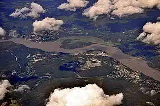 Aerial view of West Point (at the center), the Hudson River, Highland Falls (on right), Cold Spring (on left) across the river in Putnam County.
