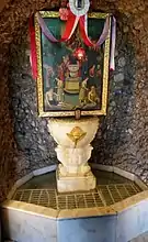 The sacred spring at the entrance of the church of Panagia Trypiti. On the marble fountain it is written the palindrome, "Wash [the] sins, not only [the] face" ΝΙΨΟΝ ΑΝΟΜΗΜΑΤΑ ΜΗ ΜΟΝΑΝ ΟΨΙΝ ("Nipson anomēmata mē monan opsin"