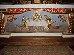 The altar with Jesus Christ and two pilgrims