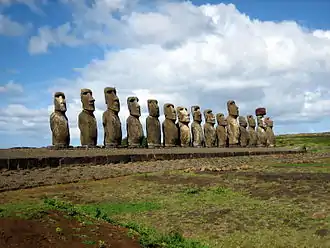 Moai of Easter Island facing inland, Ahu Tongariki, c. 1250–1500, restored by Chilean archaeologist Claudio Cristino in the 1990s