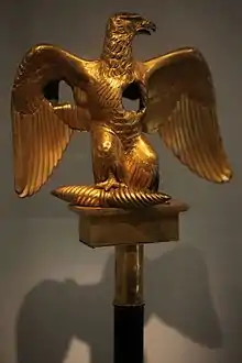 So-called "wounded Eagle" (fr. aigle blessée), Eagle damaged by enemy fire, on display at Musée de l'Armée in Paris.