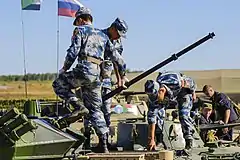 Airborne Infantry checking the 30 mm autocannon