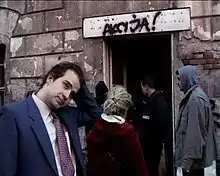 Man stands outside entrance