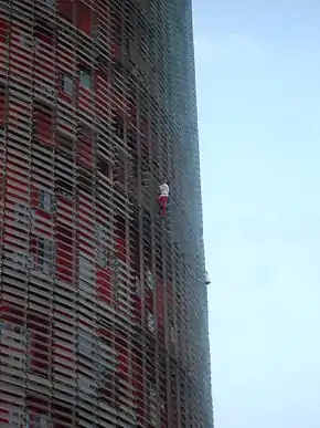 Alain Robert buildering Torre Glòries, Barcelona