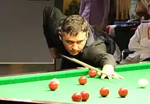 Alan McManus playing a shot