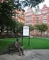 Turing Memorial with the Engineering and Physical Sciences Faculty Office of the University of Manchester in the background.