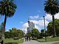 Two phoenix palms frame a view of the Sky Tower