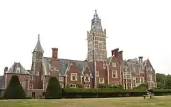 A photograph of a grand Victorian manor house