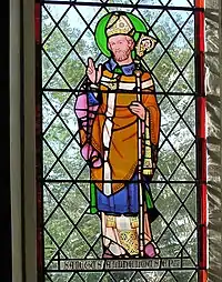 St. Stained glass window of St. Aldhelm, installed in Malmesbury Abbey in 1928.