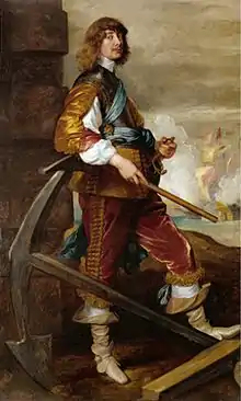 A man in 17th-century clothing stood next to an anchor.