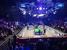 picture of a crowd behind a snooker table