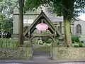 The lych gate to All Saints' Church from Church Lane