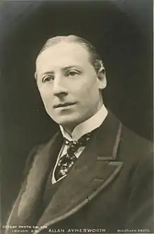 Black and white photograph of young white man, clean-shaven, with neat short hair, wearing 19th-century morning dress