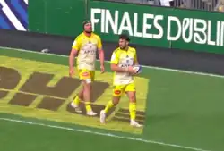 Alldritt (wearing a headguard) and Antoine Hastoy (ball in hand) playing for La Rochelle against Saracens in 2023