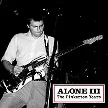 A black-and-white photo of Cuomo playing guitar