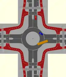 A single lane roundabout with a bidirectional circulatory cycle track and set back cycle crossings. Cyclists must give way to vehicles leaving and joining the roundabout.