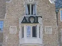 The Greek letters spelling "DOG", the symbol of the Hall