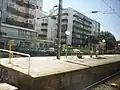 View from a train of the end of a platform at Amadora Station, August 2020