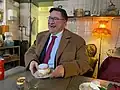 Jolly man (U.S. Ambassador Erik D. Ramanathan) enjoying a traditional Swedish semla