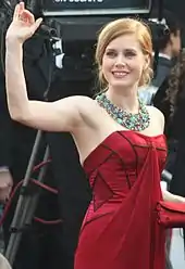 Amy Adams in a ruby red gown and bold necklace