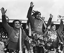 The three medal winners, Anatoly Gladychev, Sergei Tarabanko and Anatoly Bondarenko, with wreaths around their necks, wave to the public during the medal ceremony of the 1978 Individual Ice Speedway World Championship in Assen, Netherlands.