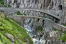 Image 37Teufelsbrücke (Devil's Bridge) on the route to the Gotthard Pass; the currently used bridge from 1958 over the first drivable bridge from 1830 (from Alps)