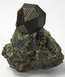 Image 22Black andradite, an end-member of the orthosilicate garnet group. (from Mineral)