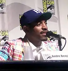 A man speaks to a microphone at the San Diego Comic Con.