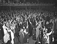 Image 2Congregation at Angelus Temple during 14-hour Holy Ghost service led by Aimee Semple McPherson in Los Angeles, California, in 1942 (from Evangelicalism in the United States)