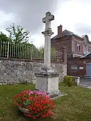 The cross with the town hall in the background