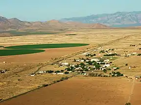 West looking view, (Animas & north Animas Valley), of State Road 9, Chiricahua Mountains massif, of Arizona on horizon. (north perimeter of New Mexico Bootheel