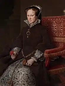 A formal seated portrait in the Spanish style of Mary I. She has a sallow fleshy face with reddish-brown hair and light eyes. Her mouth is firmly set and her eyes wary. She wears a dress of fine dark brown fur over a brocade underskirt heavily patterned in the Florentine style. Her cap is bordered with jewels and pearls. Much of her jewellery is grey pearls. She holds a pair of kid gloves and a rose.