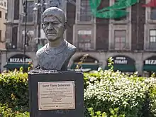 Bronze bust of a man with indigenous features in his 30s.