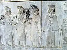 Relief from Persepolis (Iran) that represents people who carry bowls and amphoraes