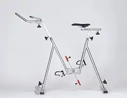 A metal frame with a seat, handlebar, and resistance paddles attached to foot pedals