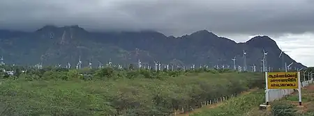 Aralvaimozhi railway station, with the wind-power mills in the background