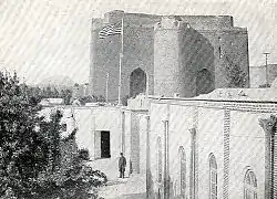 A US flag flies over the US Consulate near Arg of Tabriz during Iran's Constitutional Revolution.