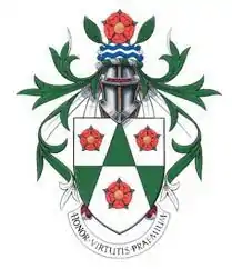 The previous Arnold School coat of arms, incorporating the red roses of Lancashire.