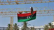 Image 31An effigy of Muammar Gaddafi hangs from a scaffold in Tripoli's Martyrs' Square, 29 August 2011 (from History of Libya)